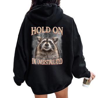 Hold On I'm Overstimulated Raccoon Women Women Oversized Hoodie Back Print - Thegiftio UK