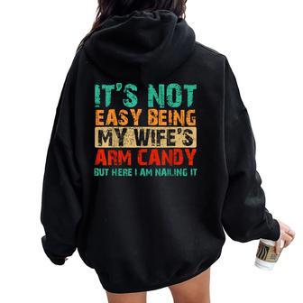 It's Not Easy Being My Wife's Arm Candy But Here I Am Women Oversized Hoodie Back Print | Mazezy
