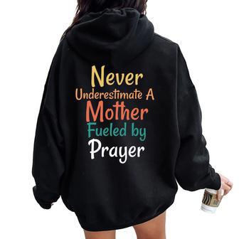Never Underestimate A Mother Fueled By Prayer Praying Mama Women Oversized Hoodie Back Print - Seseable