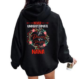 Never Underestimate Power Of A Praying Nana Floral Family Women Oversized Hoodie Back Print - Monsterry DE