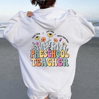 Preschool Teacher Wildflower Groovy Teacher Back To School Women Oversized Hoodie Back Print - Monsterry AU