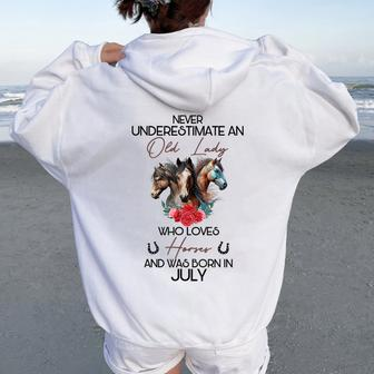 Never Underestimate An Old Lady Who Loves Horses July Women Oversized Hoodie Back Print | Mazezy