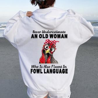 Never Underestimate An Old Woman Fluent In Fowl Language Women Oversized Hoodie Back Print - Monsterry