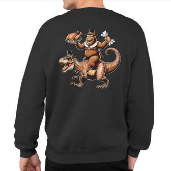 Bigfoot Riding T-Rex Vintage Thanksgiving Turkey Day Sweatshirt Back Print - Monsterry