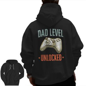 Dad Level Unlocked Pregnancy Announcement Father Gamer Zip Up Hoodie Back Print | Mazezy