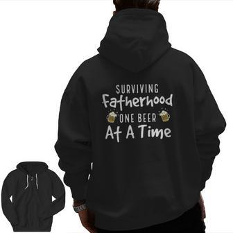 Drinking Dad Surviving Fatherhood One Beer At A Time Father's Day Beer Mugs Zip Up Hoodie Back Print | Mazezy