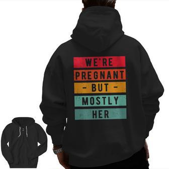 We're Pregnant But Mostly Her Humor Dad Announcement Zip Up Hoodie Back Print | Mazezy