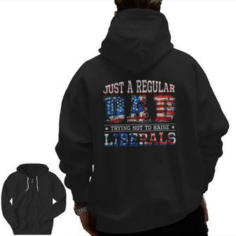 Just A Regular Dad Trying Not To Raise Liberals American Flag Colors Zip Up Hoodie Back Print | Mazezy