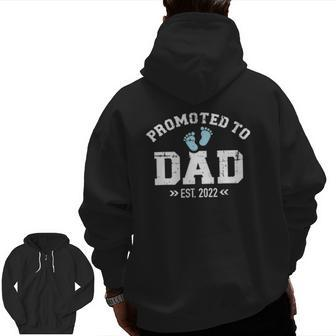 Promoted To Dad 2022 Baby Feets Zip Up Hoodie Back Print | Mazezy