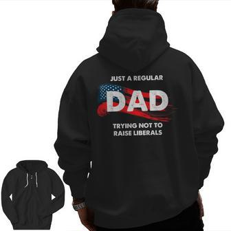 Republican Just A Regular Dad Trying Not To Raise Liberals Zip Up Hoodie Back Print | Mazezy