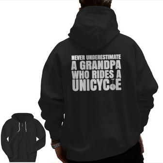 Never Underestimate A Grandpa Who Rides A Unicycle Zip Up Hoodie Back Print | Mazezy DE