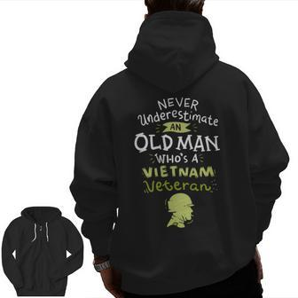 Never Underestimate An Old Man Who's A Vietnam Veteran Veteran Zip Up Hoodie Back Print | Mazezy