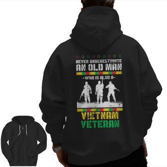Never Underestimate An Old Men Who Is Also A Vietnam Veteran Veteran Zip Up Hoodie Back Print | Mazezy