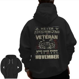 Never Underestimate A Veteran Who Was Born In November Zip Up Hoodie Back Print | Mazezy
