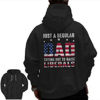 Vintage Just A Regular Dad Trying Not To Raise Liberals Zip Up Hoodie Back Print | Mazezy