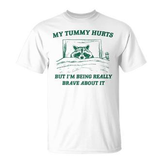 My Tummy Hurts But I'm Being Really Brave Raccoon T-Shirt - Seseable