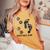 Never Walk Alone Paw Dog Flower Dog Friends Dog Lover Women's Oversized Comfort T-shirt Mustard