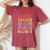 I Didn't Plan On Becoming A Soccer Mom But Here I Am Women's Oversized Comfort T-Shirt Crimson