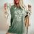 Never Underestimate A Girl With A Lacrosse Stick Women's Oversized Comfort T-Shirt Moss