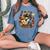 Raccoon Playing Guitar Cottagecore Floral Racoon Animal Women's Oversized Comfort T-Shirt Blue Jean