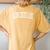 Vintage Alum Creek Lake Distressed White Varsity Style Women's Oversized Comfort T-Shirt Back Print Mustard