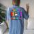 Autism Mom Raising Hero Groovy Messy Bun Autism Awareness Women's Oversized Comfort T-Shirt Back Print Moss