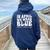 In April We Wear Blue Groovy Autism Awareness Women Oversized Hoodie Back Print Navy Blue