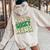 One Lucky Mama Groovy Retro Mama St Patrick's Day Women Oversized Hoodie Back Print Sand
