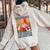 Never Underestimate Old Woman Fluent Fowl Born In April Women Oversized Hoodie Back Print Sand