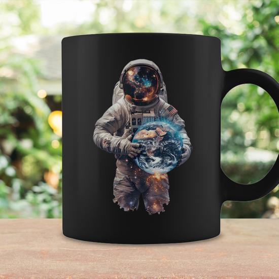 Astronaut Holds Earth In Space Coffee Mug - Monsterry