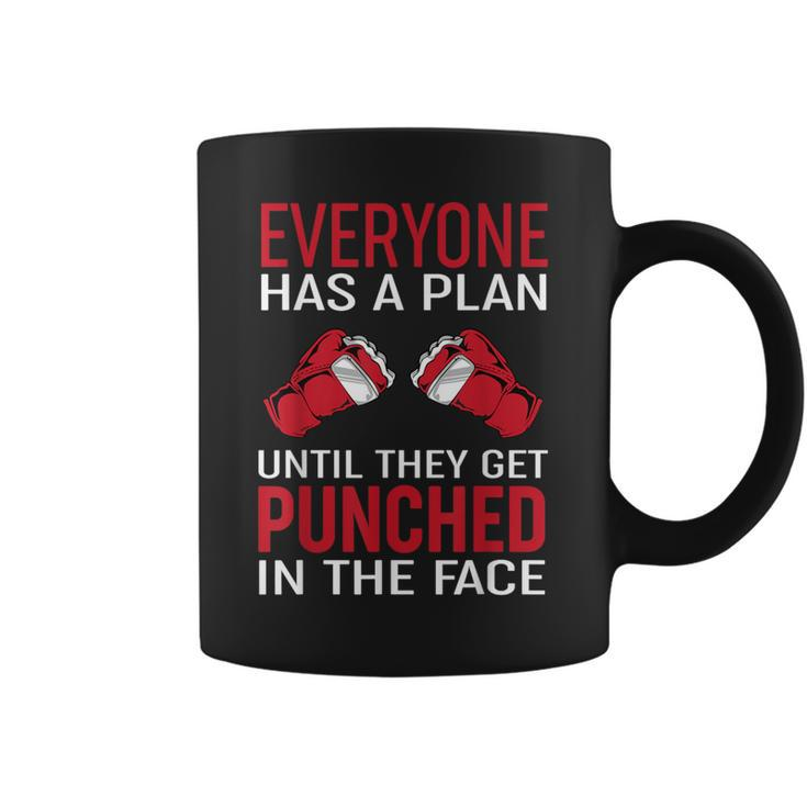 Everyone Has A Plan Until They Get Punched In The Face Coffee Mug