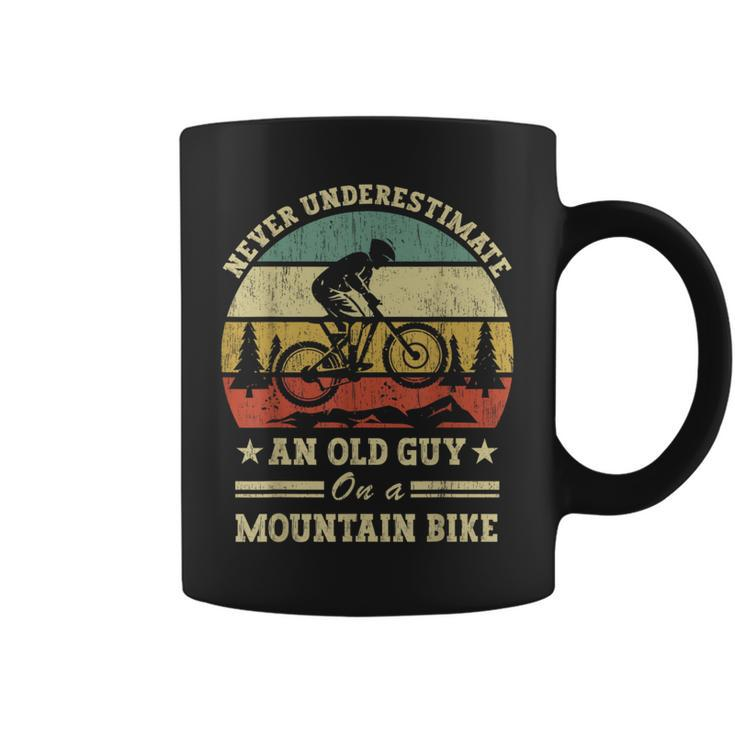 Never Underestimate An Old Guy On A Mountain Bike Coffee Mug