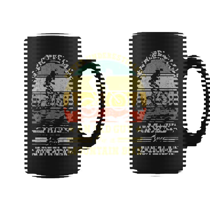 Never Underestimate An Old Guy On A Mountain Bike Coffee Mug