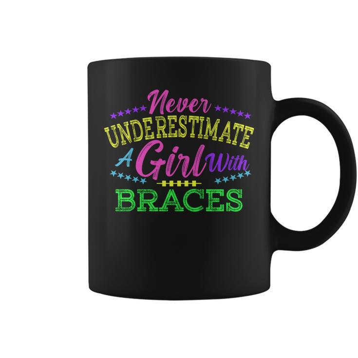 Never Underestimate A Girl With Braces Coffee Mug