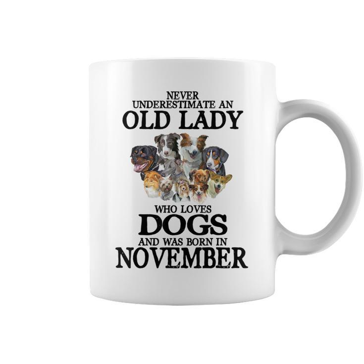 Never Underestimate An Old Lady Who Loves Dogs Born November Coffee Mug