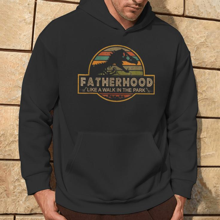 Fatherhood Is A Walk In The Park — Dino Father's Day Hoodie Lifestyle