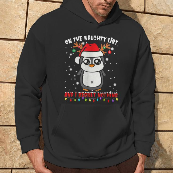 On The Naughty List And I Regret Nothing Penguin Xmas Hoodie Lifestyle