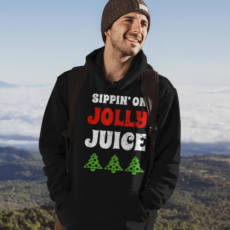 Sippin' On Jolly Juice Christmas Tree Hoodie Lifestyle