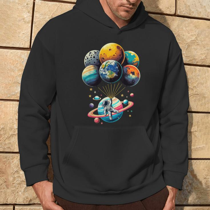 Solar System Astronaut Holding Planet Balloons Space Hoodie Lifestyle