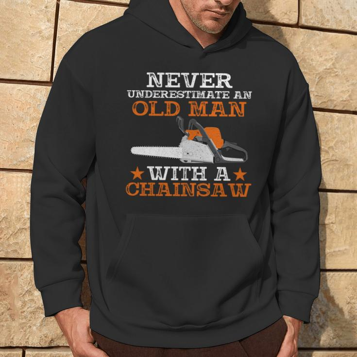 Never Underestimate An Old Man With Chainsaw Lumberjack Wood Hoodie Lifestyle