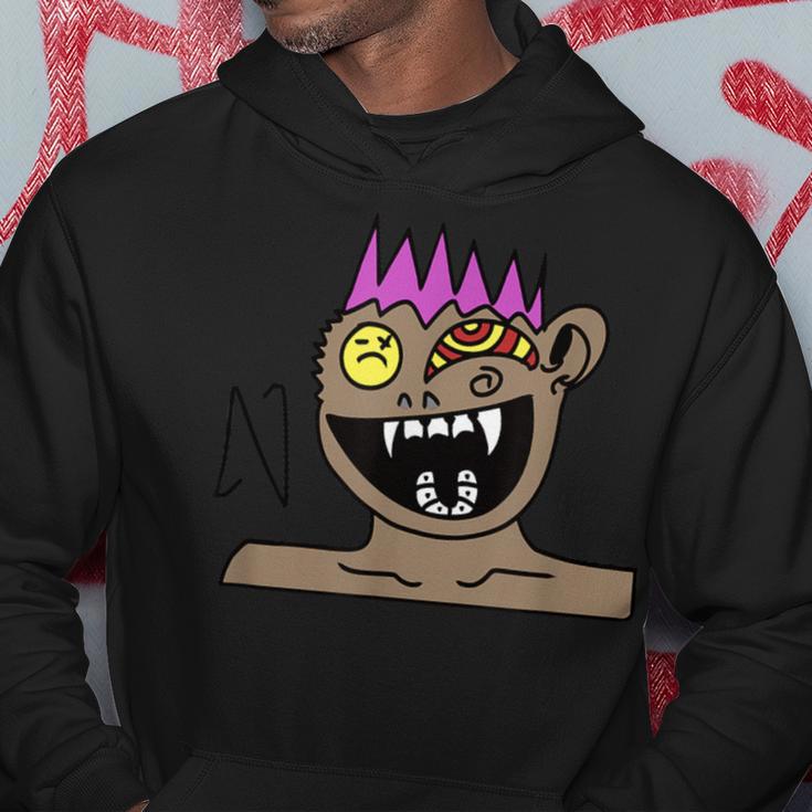 Funky Monster Gesicht Hoodie Schwarz mit Farbakzenten Lustige Geschenke