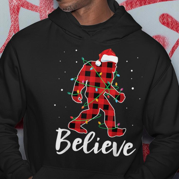 Believe Plaid Bigfoot Christmas Light Sasquatch Santa Hoodie Personalized Gifts