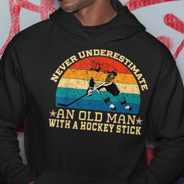 Never Underestimate An Old Man With A Hockey Stick Hoodie Unique Gifts