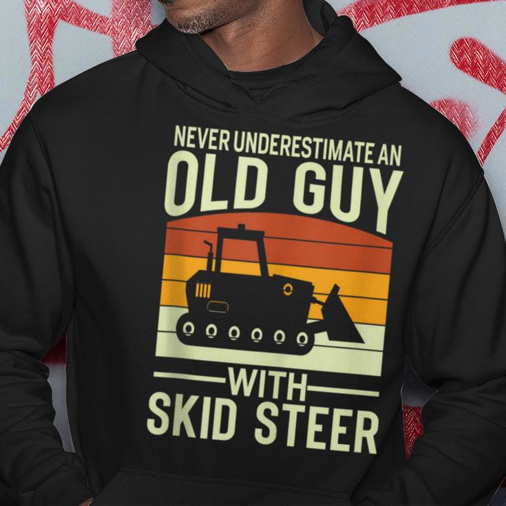 Never Underestimate Old Guy With A Skid Sr Construction Hoodie Personalized Gifts
