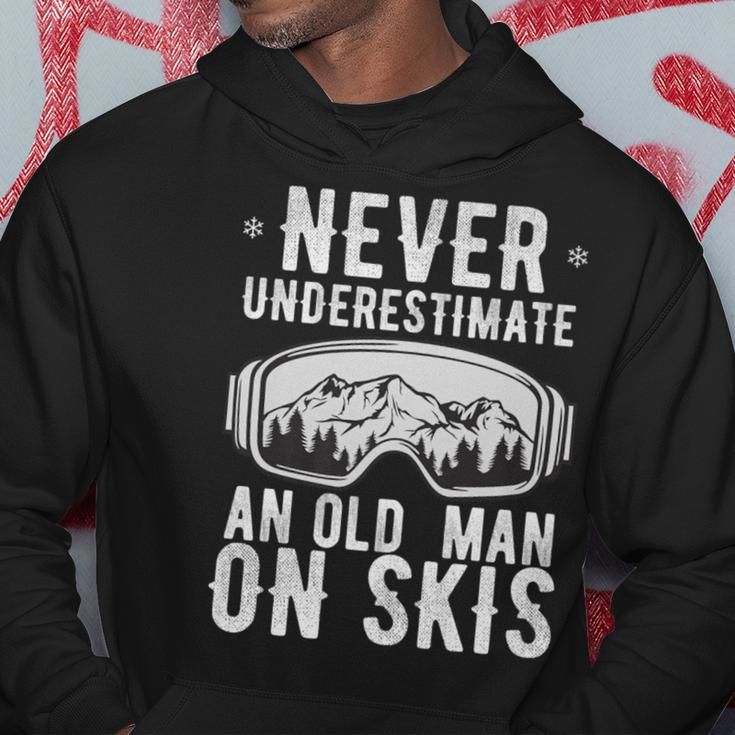 Never Underestimate An Old Man On Skis Winter Holiday Hoodie Funny Gifts