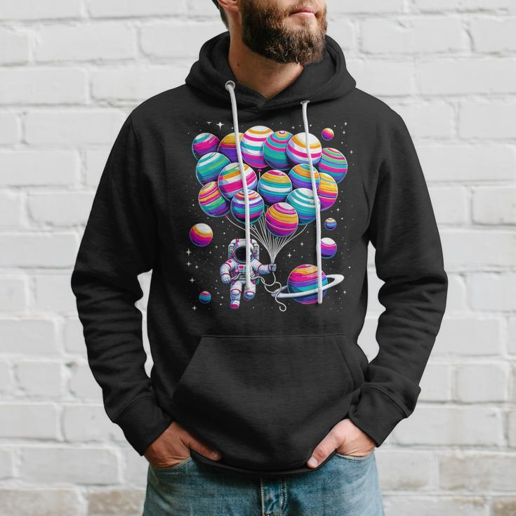 Astronaut Holding Planet Balloons Stem Science Hoodie Gifts for Him