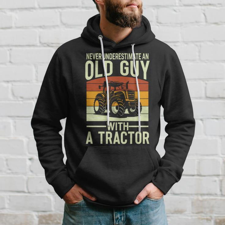 Never Underestimate An Old Guy With A Tractor Farmer Hoodie Gifts for Him