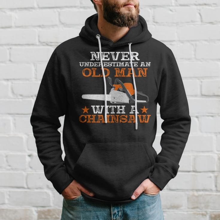 Never Underestimate An Old Man With Chainsaw Lumberjack Wood Hoodie Gifts for Him