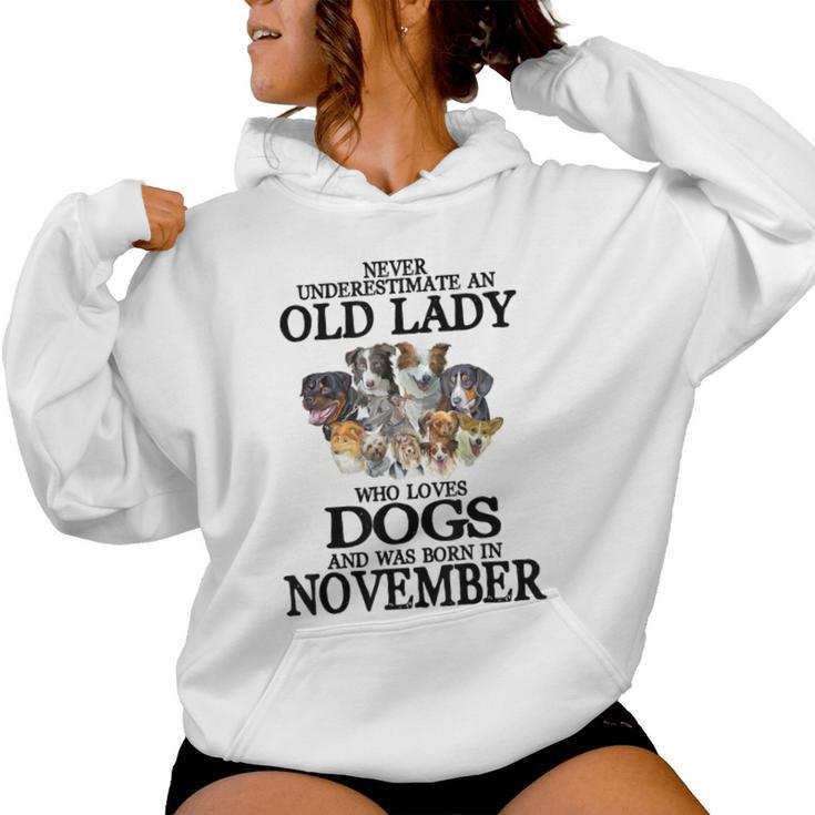 Never Underestimate An Old Lady Who Loves Dogs Born November Women Hoodie