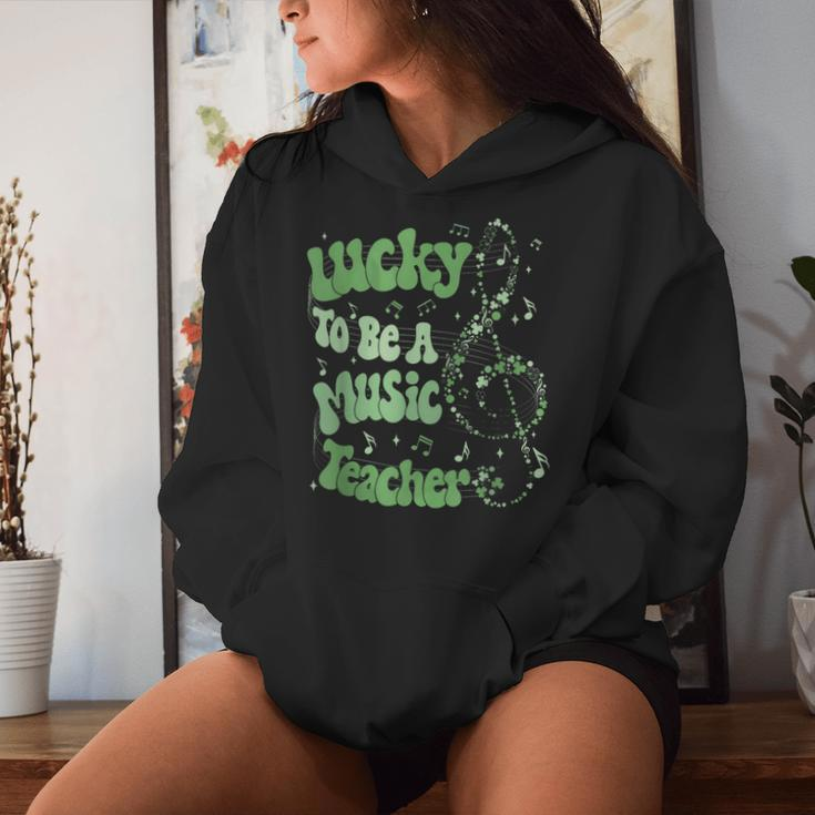 Retro Groovy Lucky To Be A Music Teacher St Patrick's Day Women Hoodie Gifts for Her